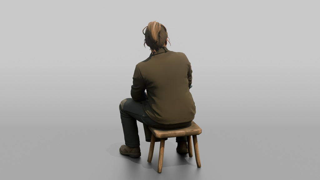 Farmer Sitting On Stool In Milking Position