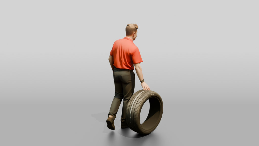 Mechanic Rolling a Performance Tire