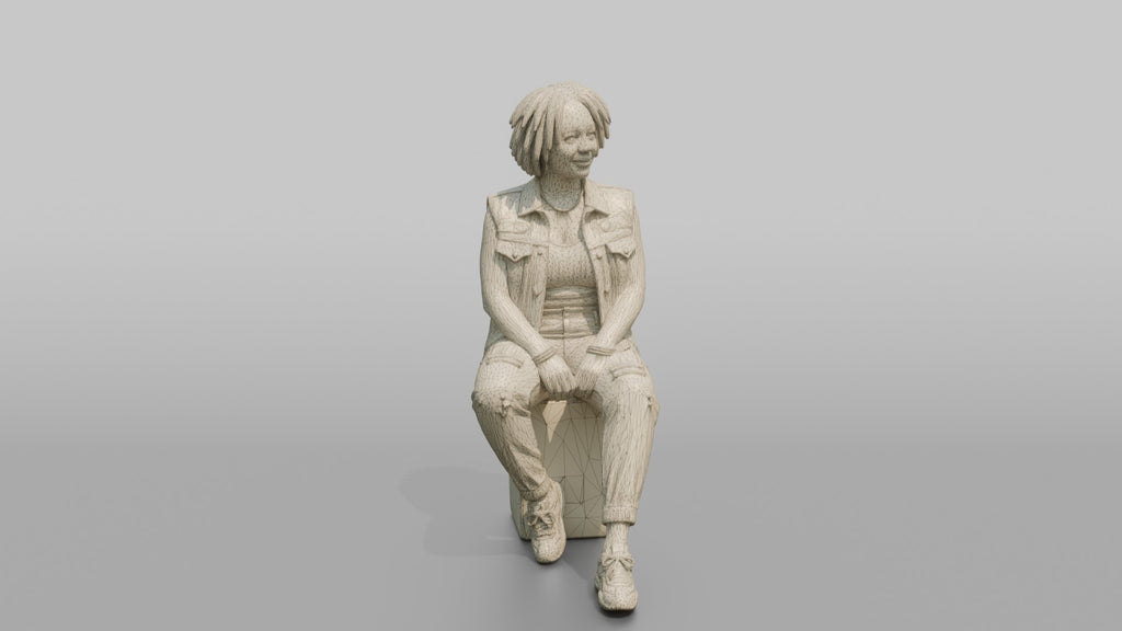 African Woman in Denim Vest Sitting on Concrete Block