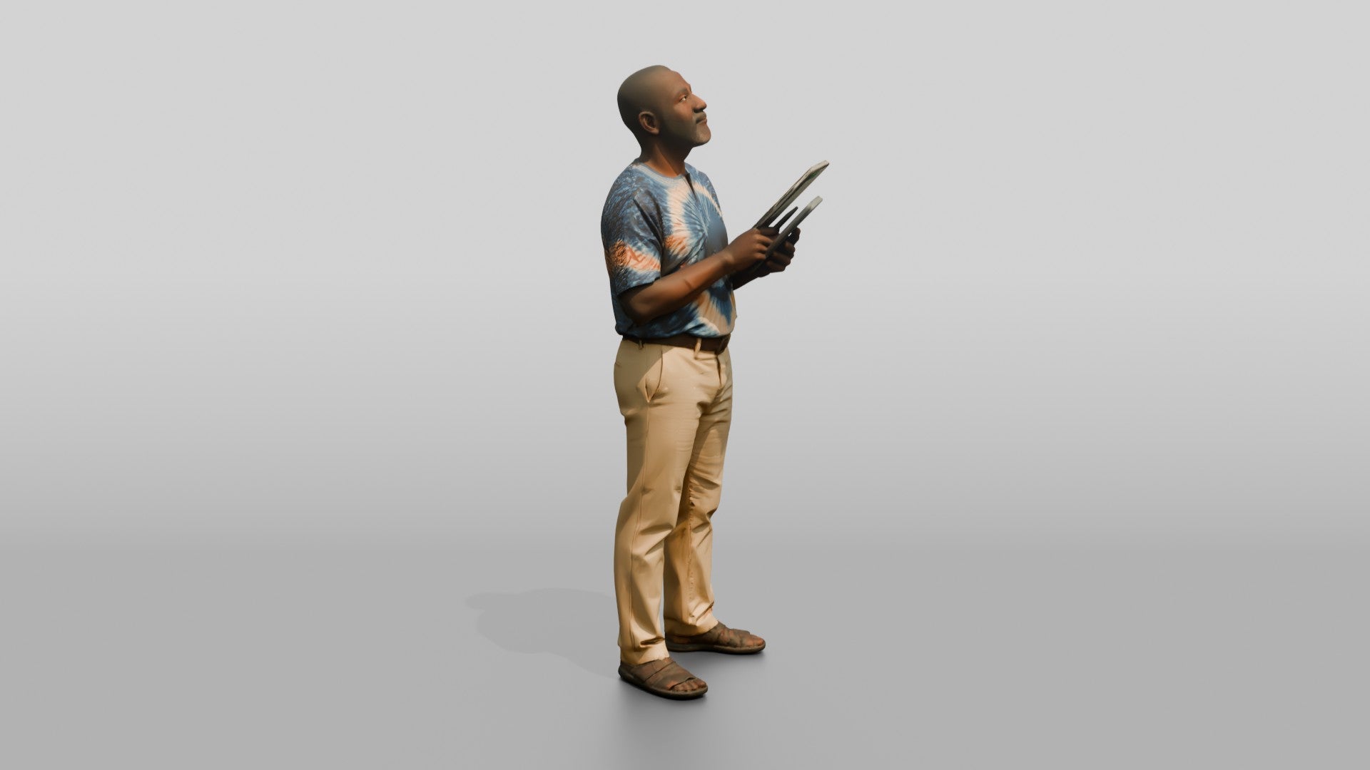 Elderly African Man Holding a Tablet Looking Up