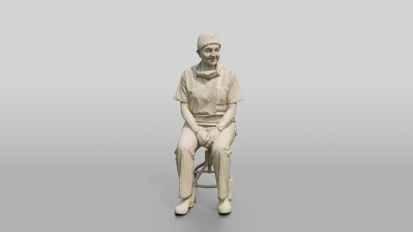 Middle-Aged South Asian Woman Doctor Sitting on Stool