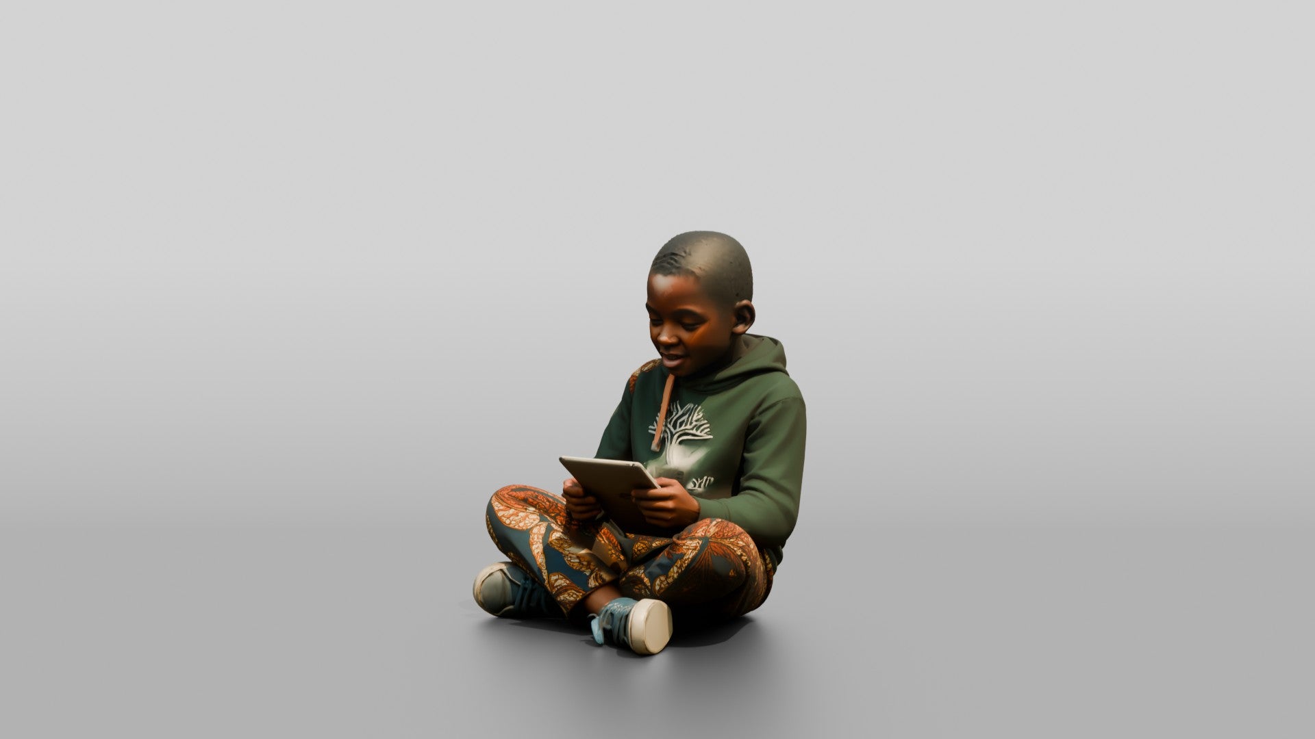 African Boy Sitting Cross-Legged with a Tablet