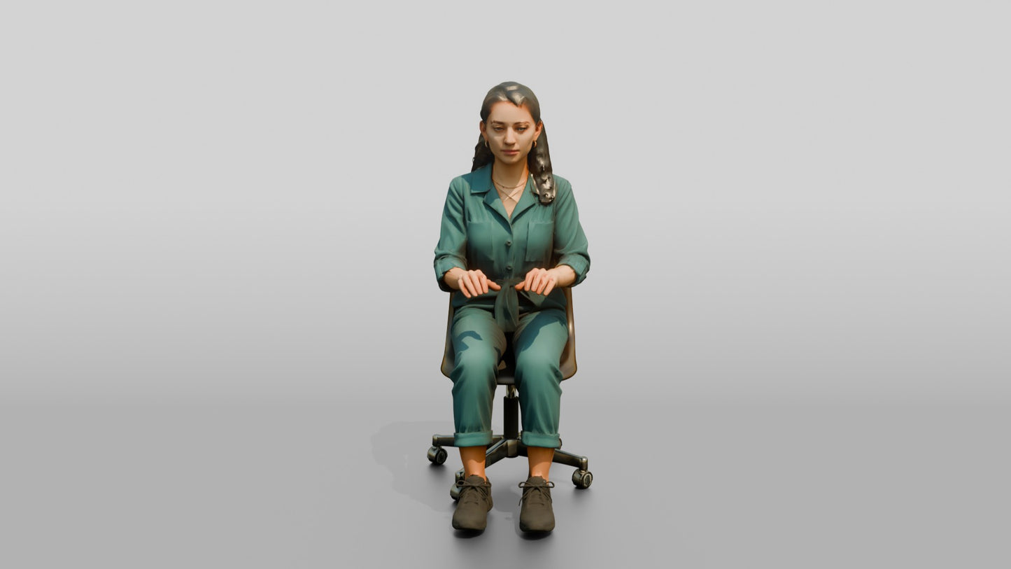 Woman Seated in a Teal Jumpsuit