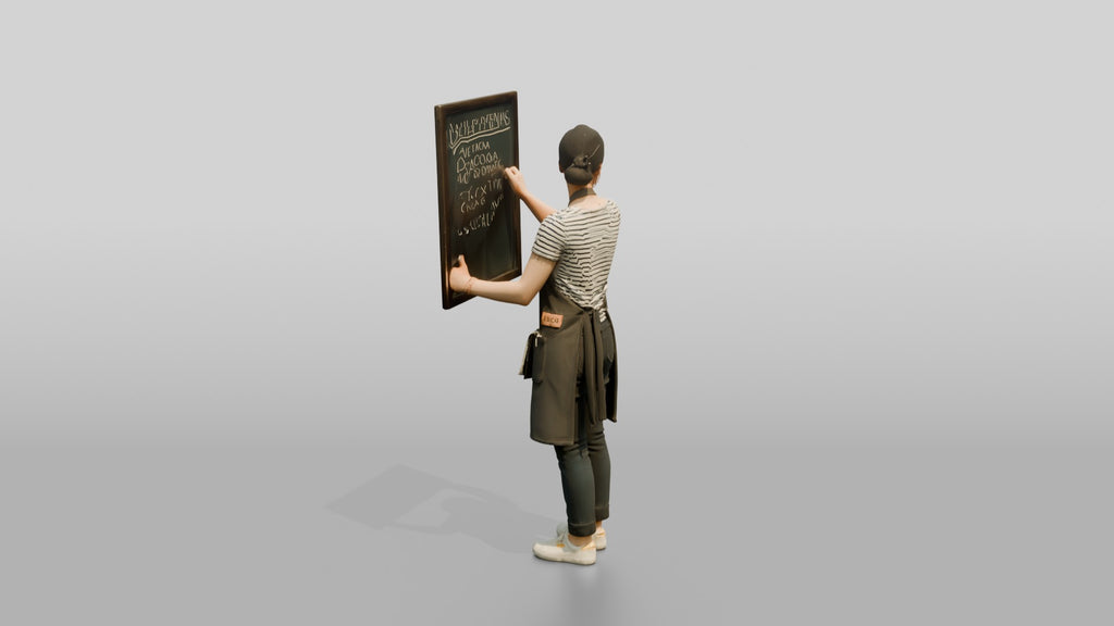 East Asian Woman Barista Writing Chalk Menu