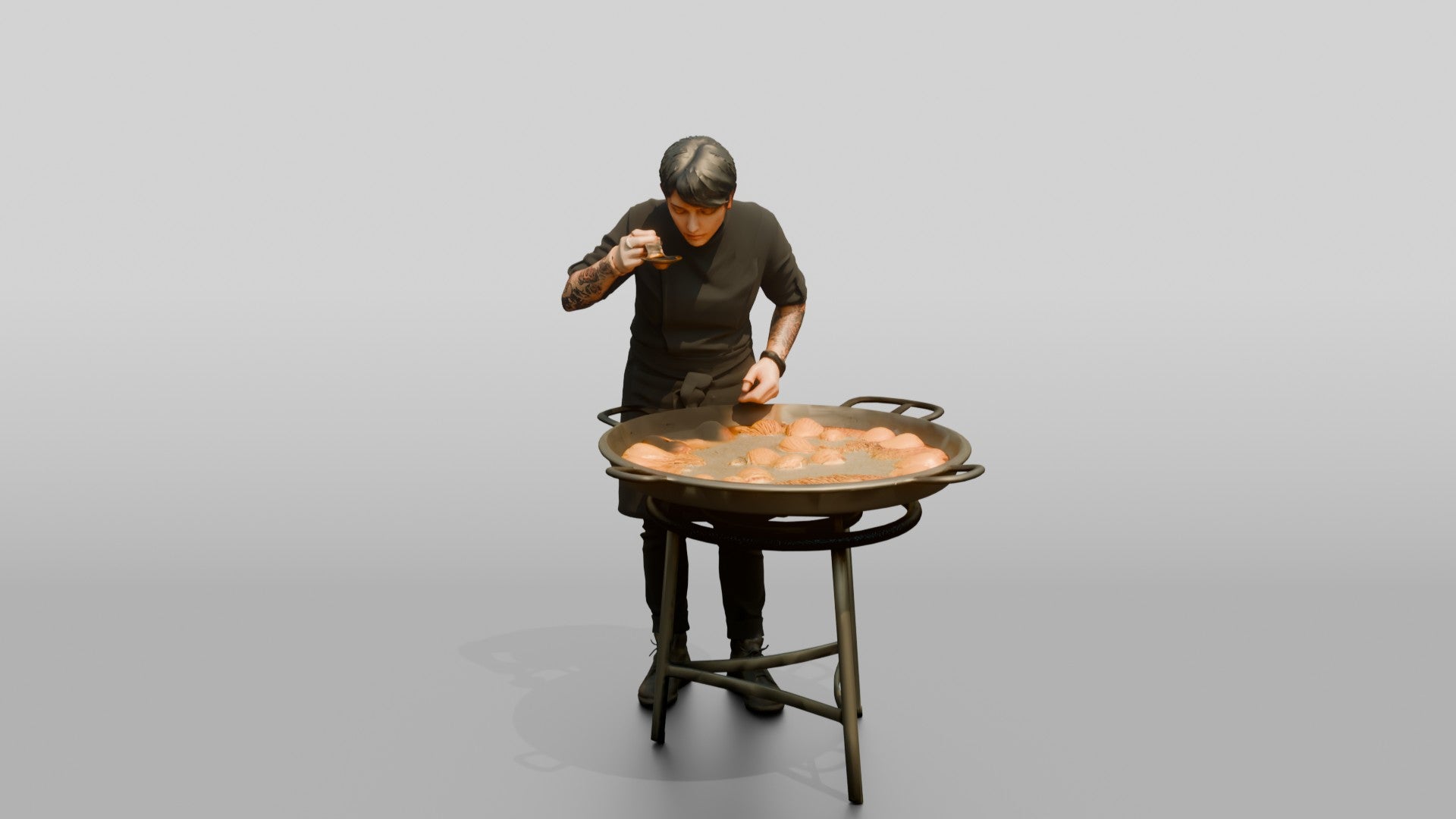 Chef Checking a Paella Pan