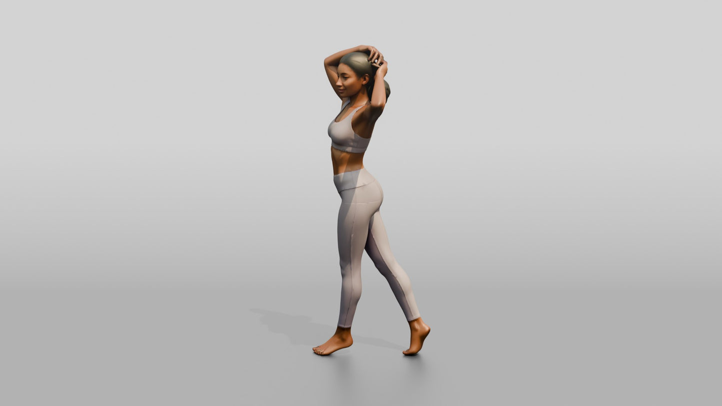 Woman in Lilac Activewear with Arms Raised to Her Hair