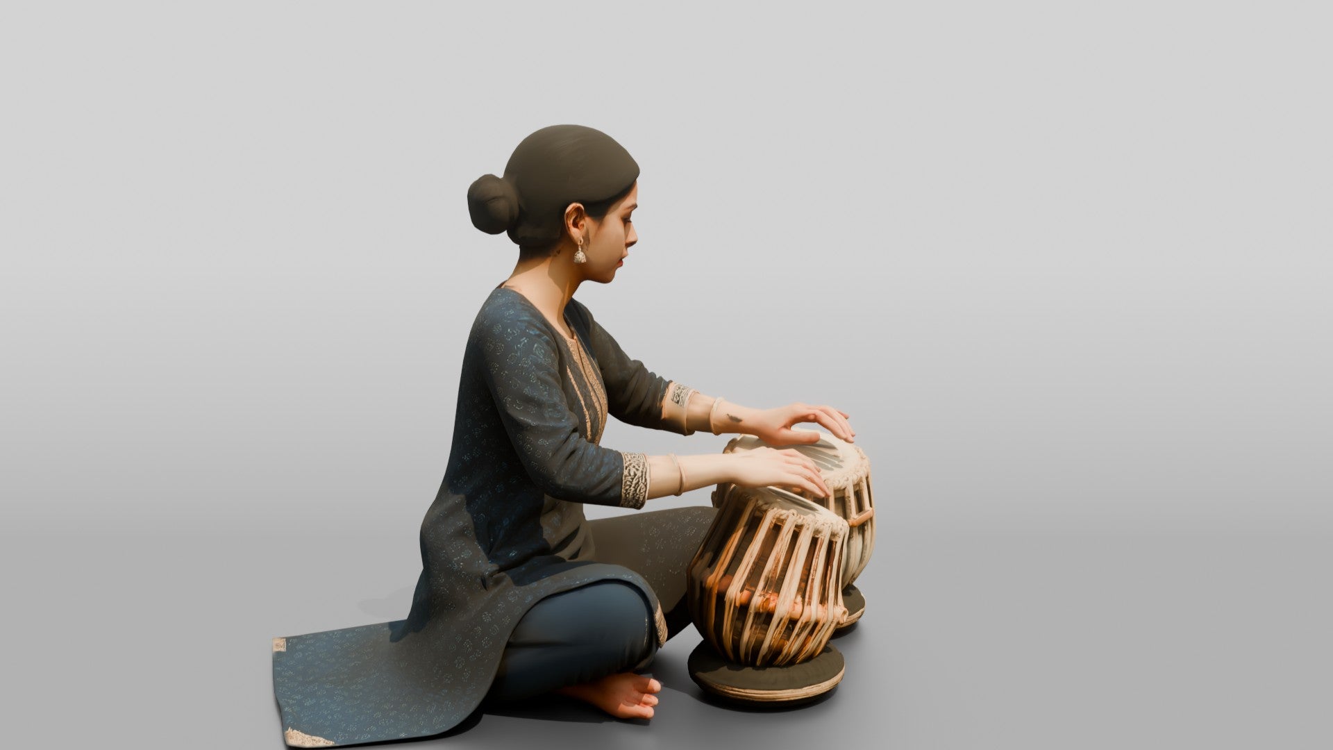 Tabla Player Seated with Twin Drums