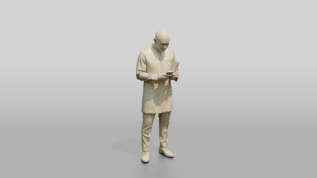 African Man in a Senator-Style Suit Checking His Phone