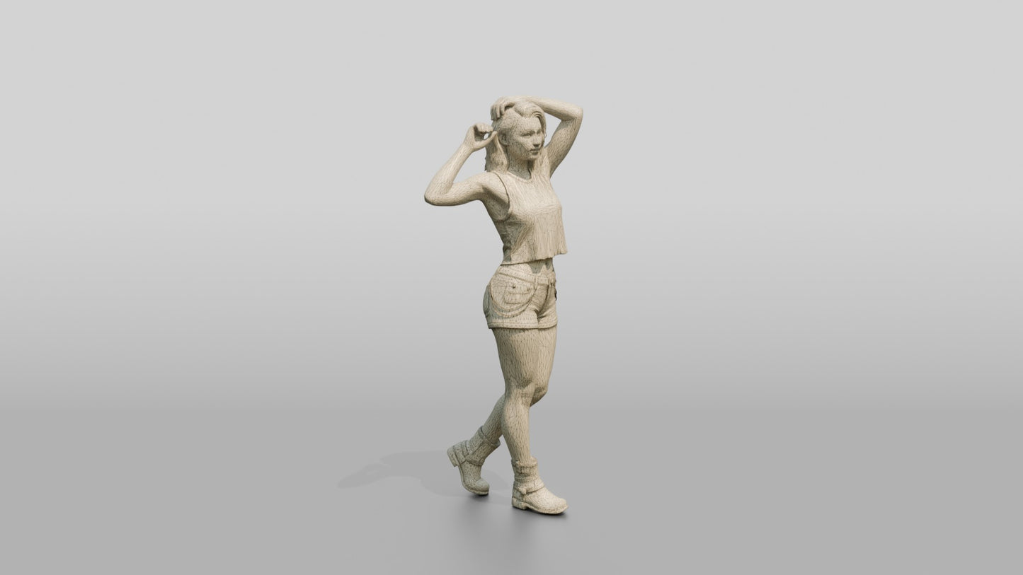 Woman Adjusting Her Hair in Cream Top and Denim Shorts