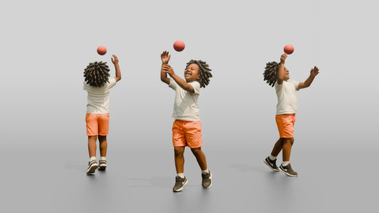 Stocky Maltese Boy Tossing a Red Ball in the Air