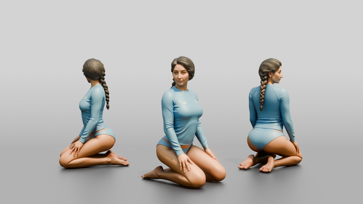 Woman in Blue Rash Guard Kneeling