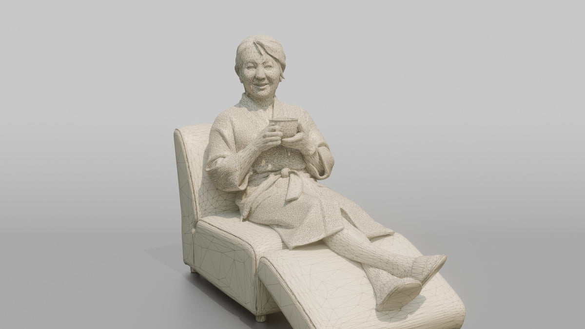 Spa Client Man Sitting On A Lounge Chair In A Robe, Holding A Cup Of Tea - wireframe topology preview