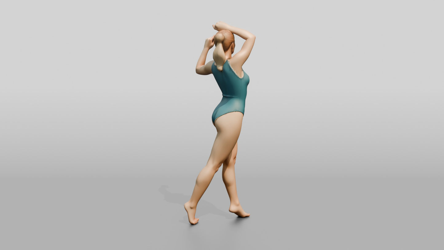 Woman in Teal Swimsuit in a Dancing Pose