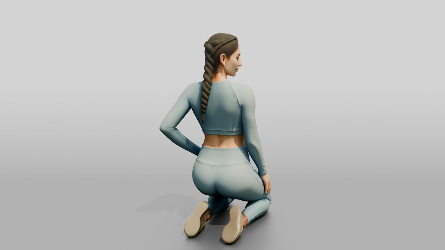 Woman Kneeling in Dusty Blue Long-Sleeve Activewear