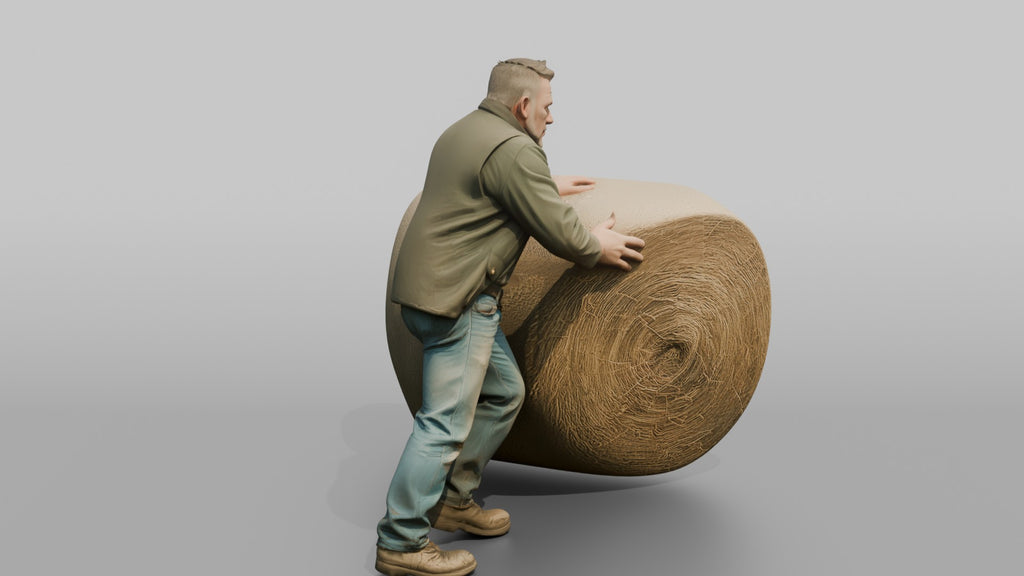 Farmer Rolling Large Round Hay Bale