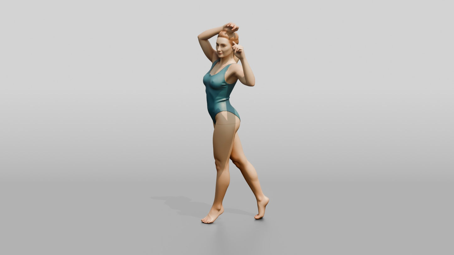 Woman in Teal Swimsuit in a Dancing Pose