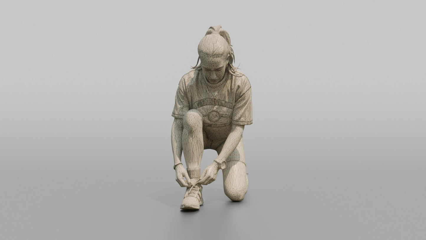 Woman Kneeling to Adjust Her Sneaker Laces