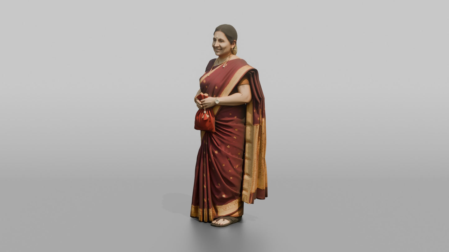 South Asian Wedding Guest Holding a Velvet Gift Pouch