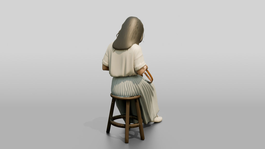 Woman Sitting with Designer Pouch