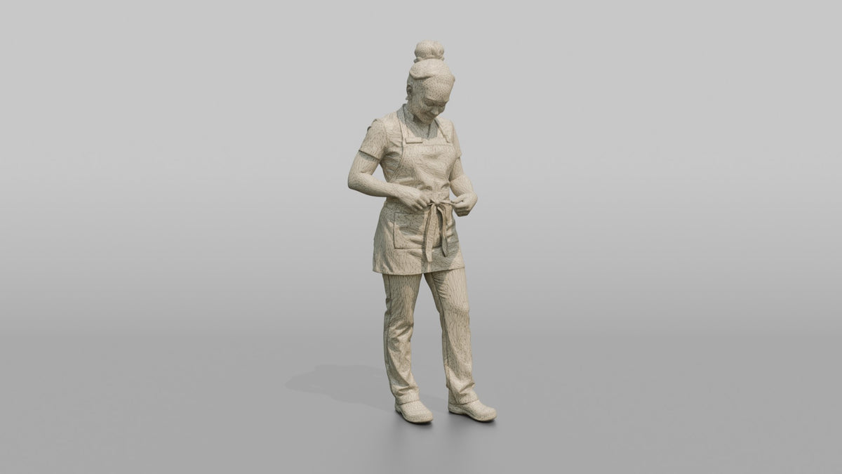 Massage Therapist Woman Adjusting A Spa Apron At The Waist - wireframe topology preview