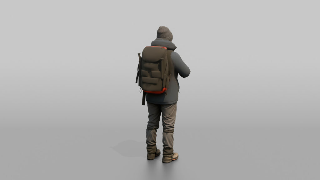 Winter Hiker Zipping Up Her Jacket