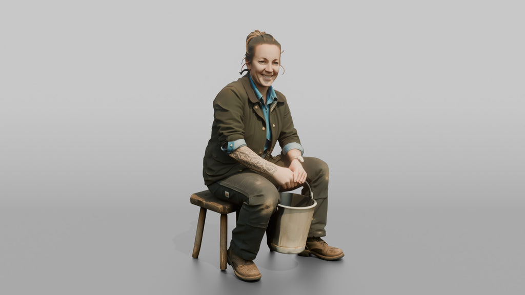 Farmer Sitting On Stool In Milking Position