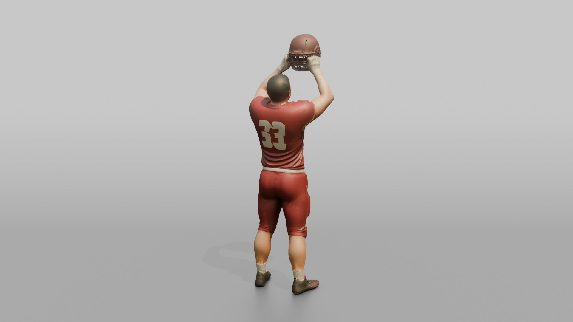 Player Raising His Helmet Triumphantly