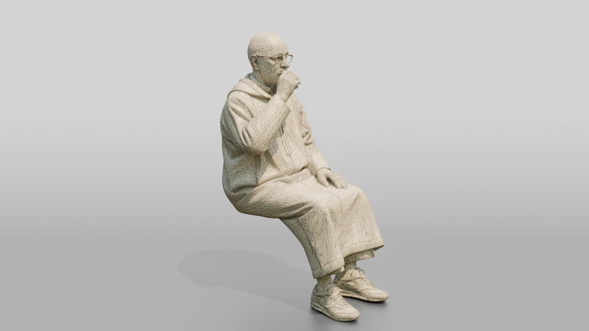 Elderly African Man in a Djellaba Sitting and Drinking Tea