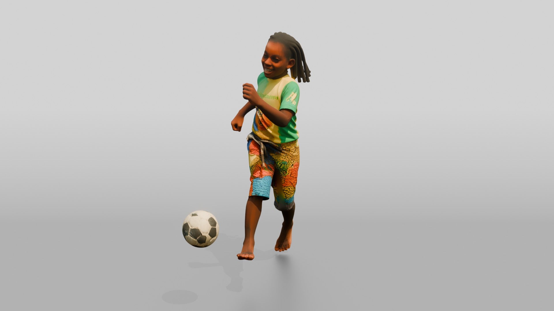 African Boy Playing Soccer in Patchwork Shorts