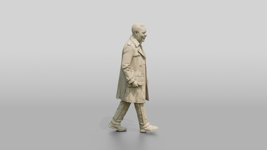 Elderly African Man in a Trench Coat Holding a Tablet
