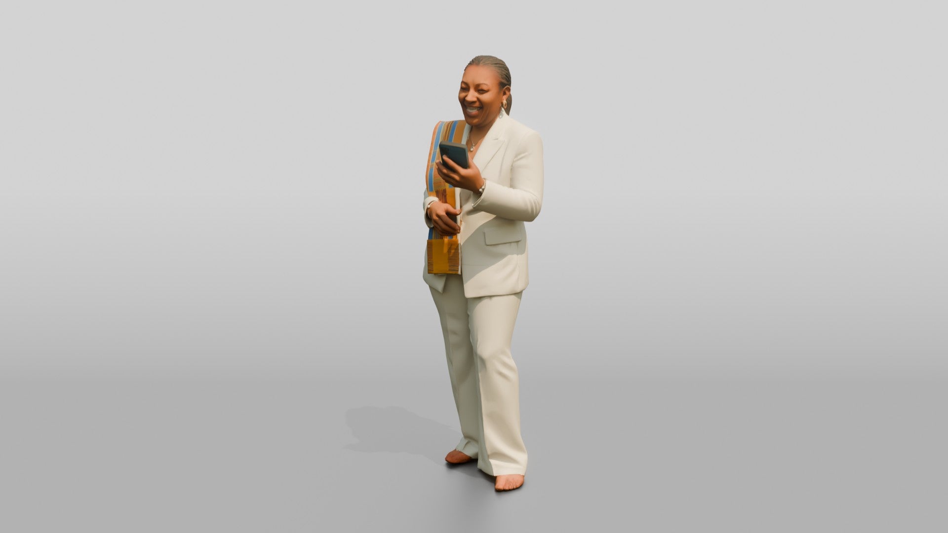 African Woman in a White Pantsuit Laughing at Her Phone