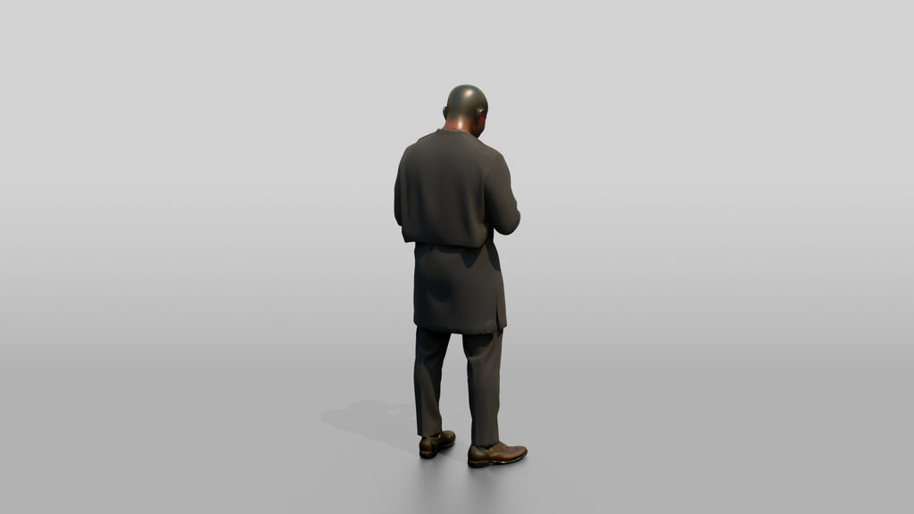 African Man in a Senator-Style Suit Checking His Phone