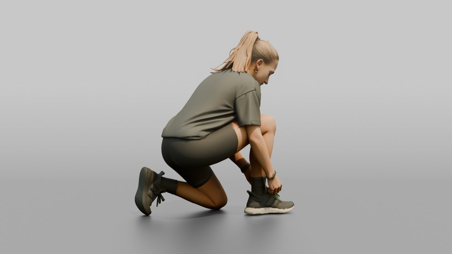 Woman Kneeling to Adjust Her Sneaker Laces