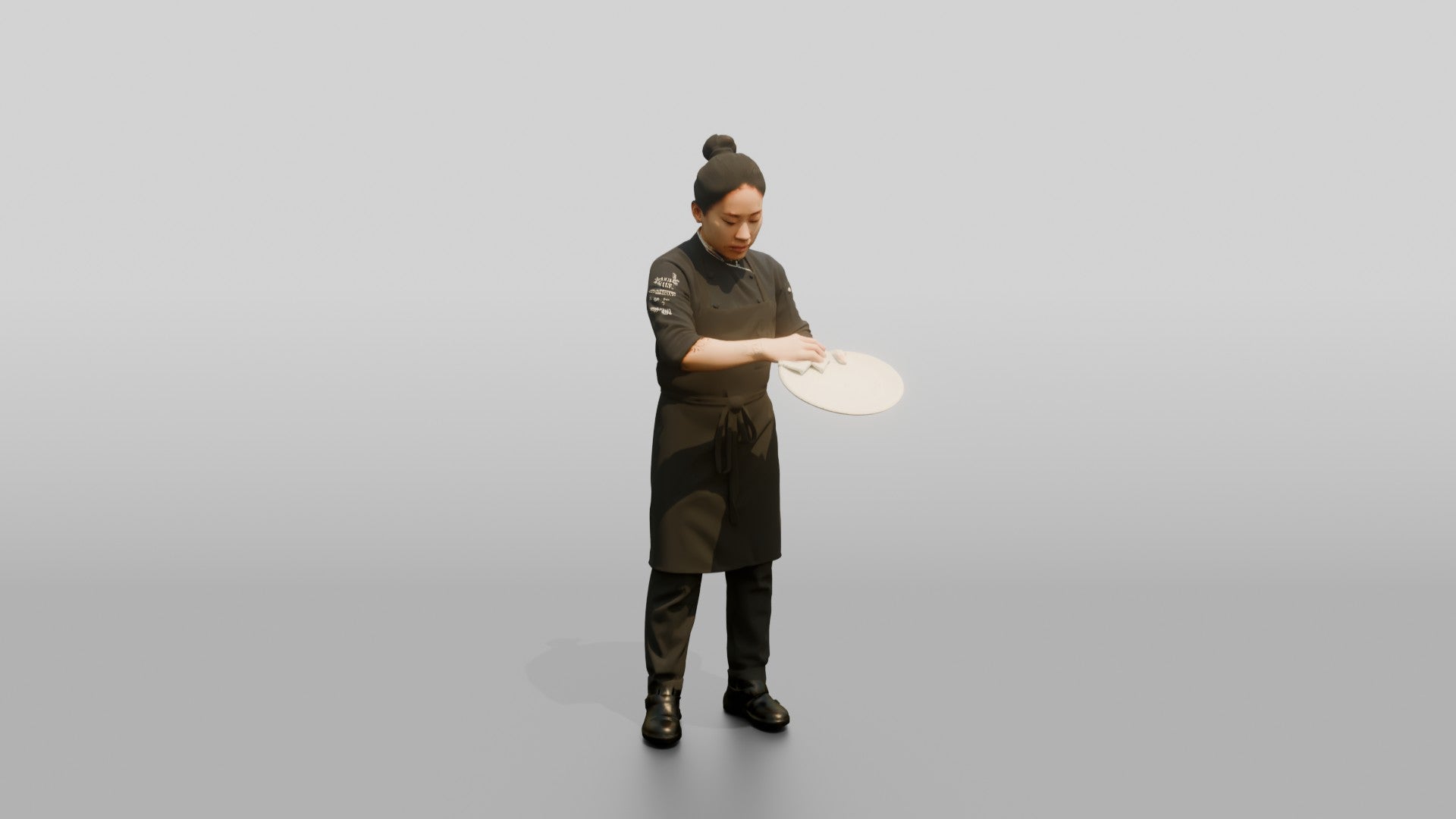Chef Wiping a Plate Rim