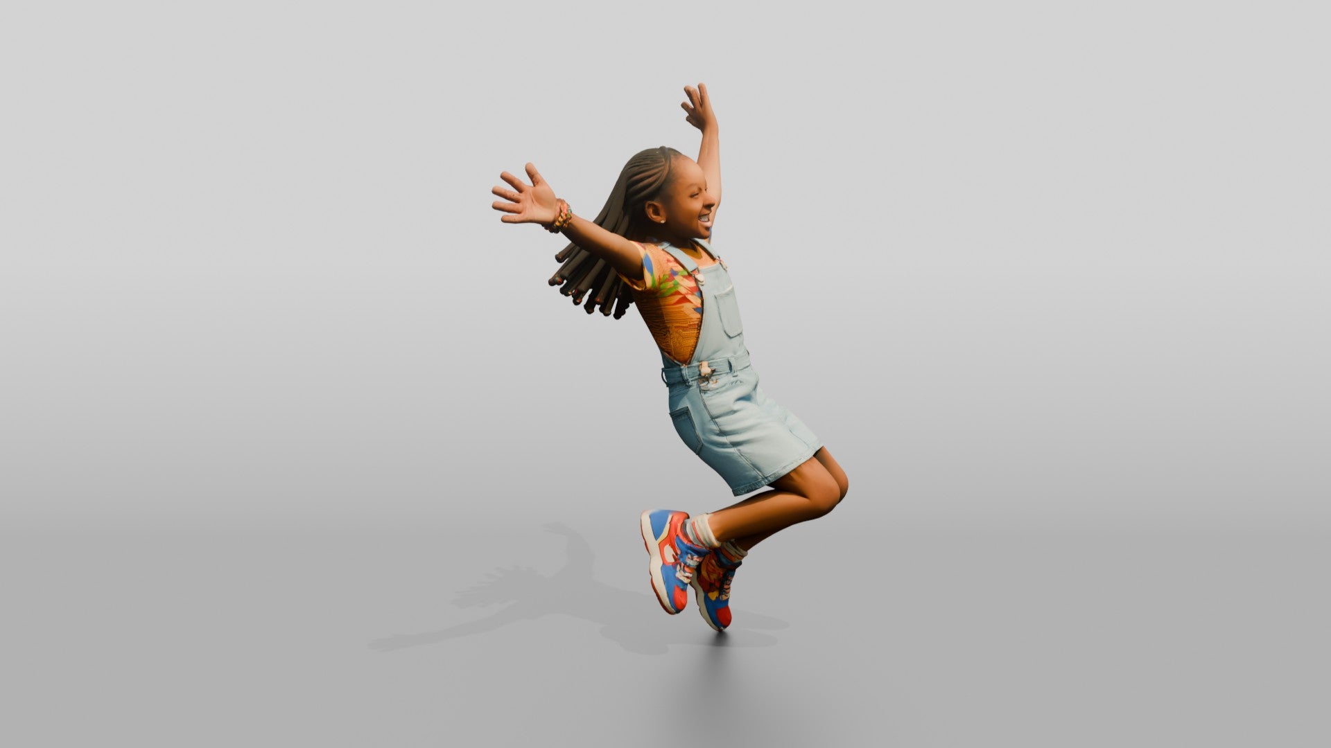 African Girl Jumping Excitedly in a Denim Overall Dress