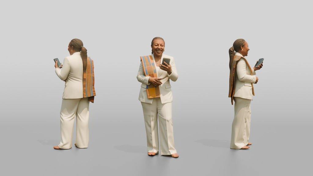 African Woman in a White Pantsuit Laughing at Her Phone