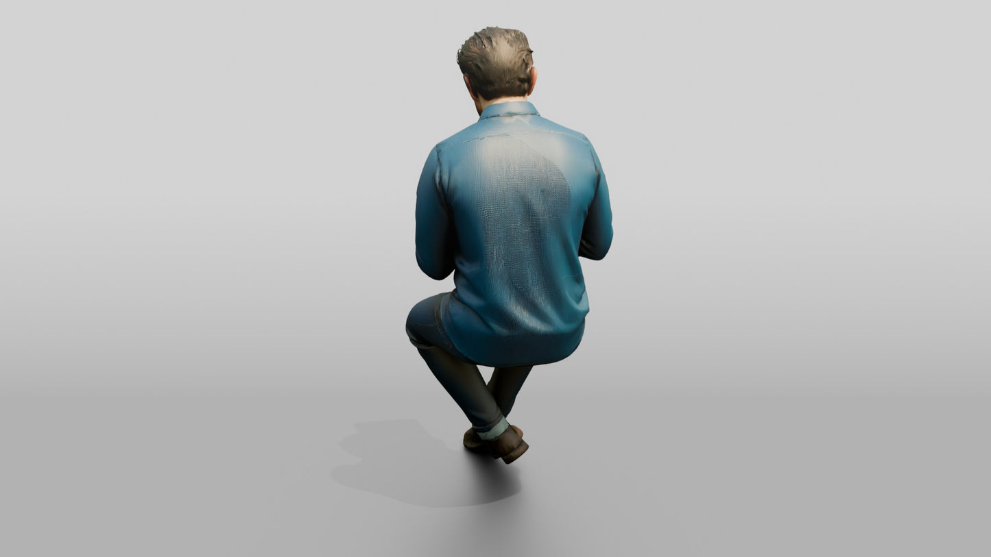 Man Using a Tablet on a Stool