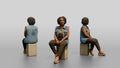 African Woman in Denim Vest Sitting on Concrete Block
