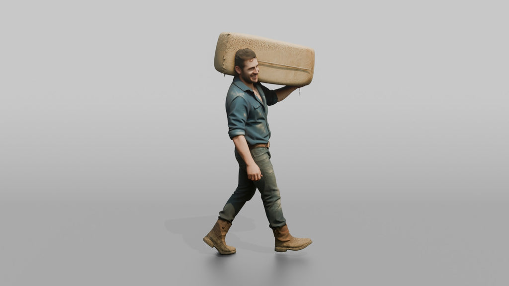 Farmer Carrying Large Bale Of Hay Over