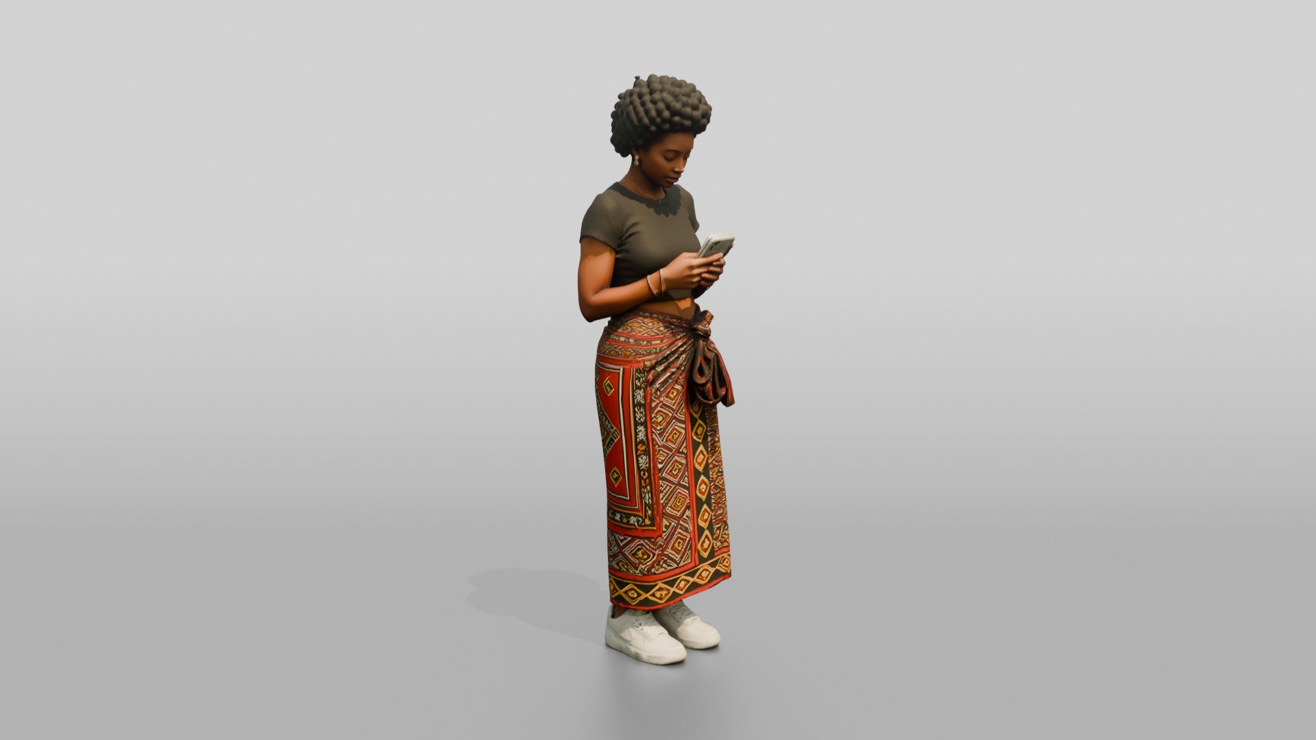 African Woman in a Wrap Skirt Looking at Her Phone