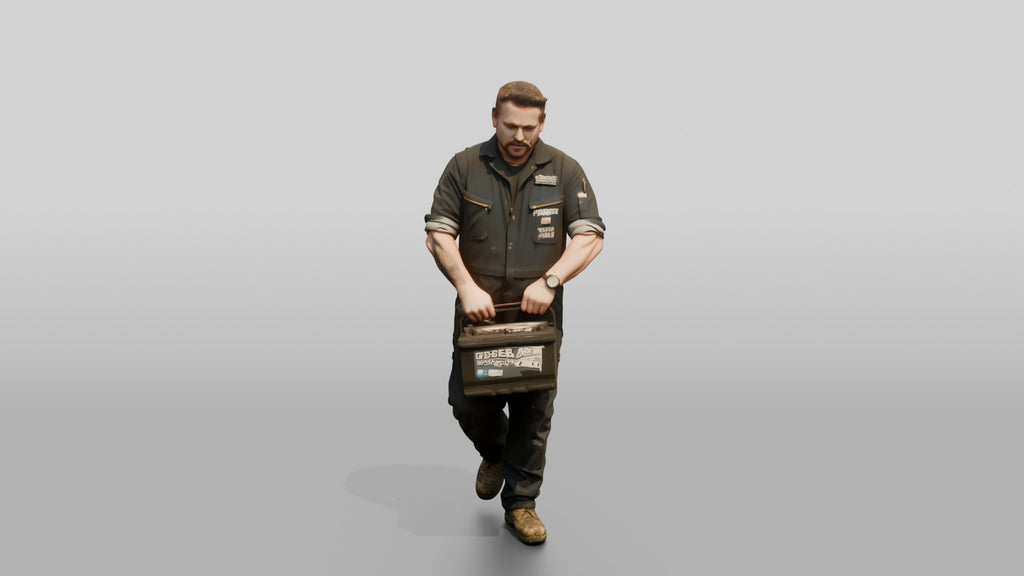 Mechanic Carrying a Car Battery