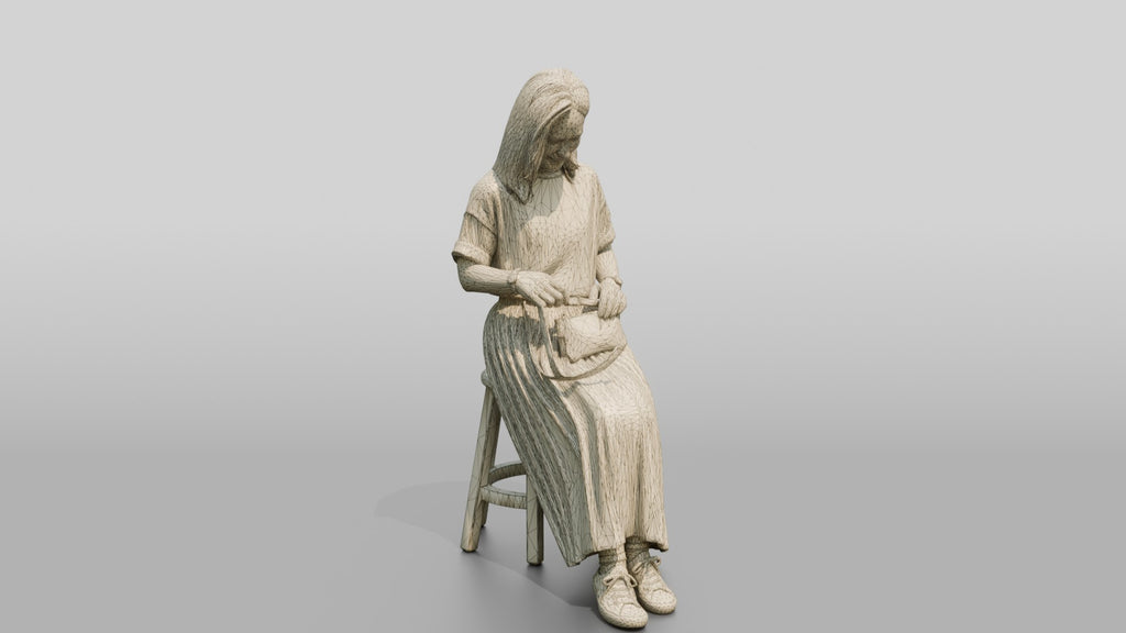 Woman Sitting with Designer Pouch