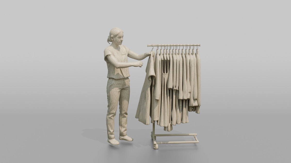 Woman Sales Associate Straightening A Rack Of Dresses - wireframe topology preview