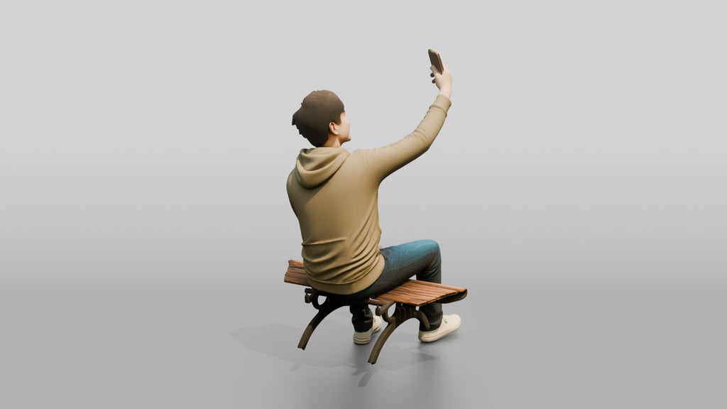 Young Chinese Man Taking a Selfie on a Bench