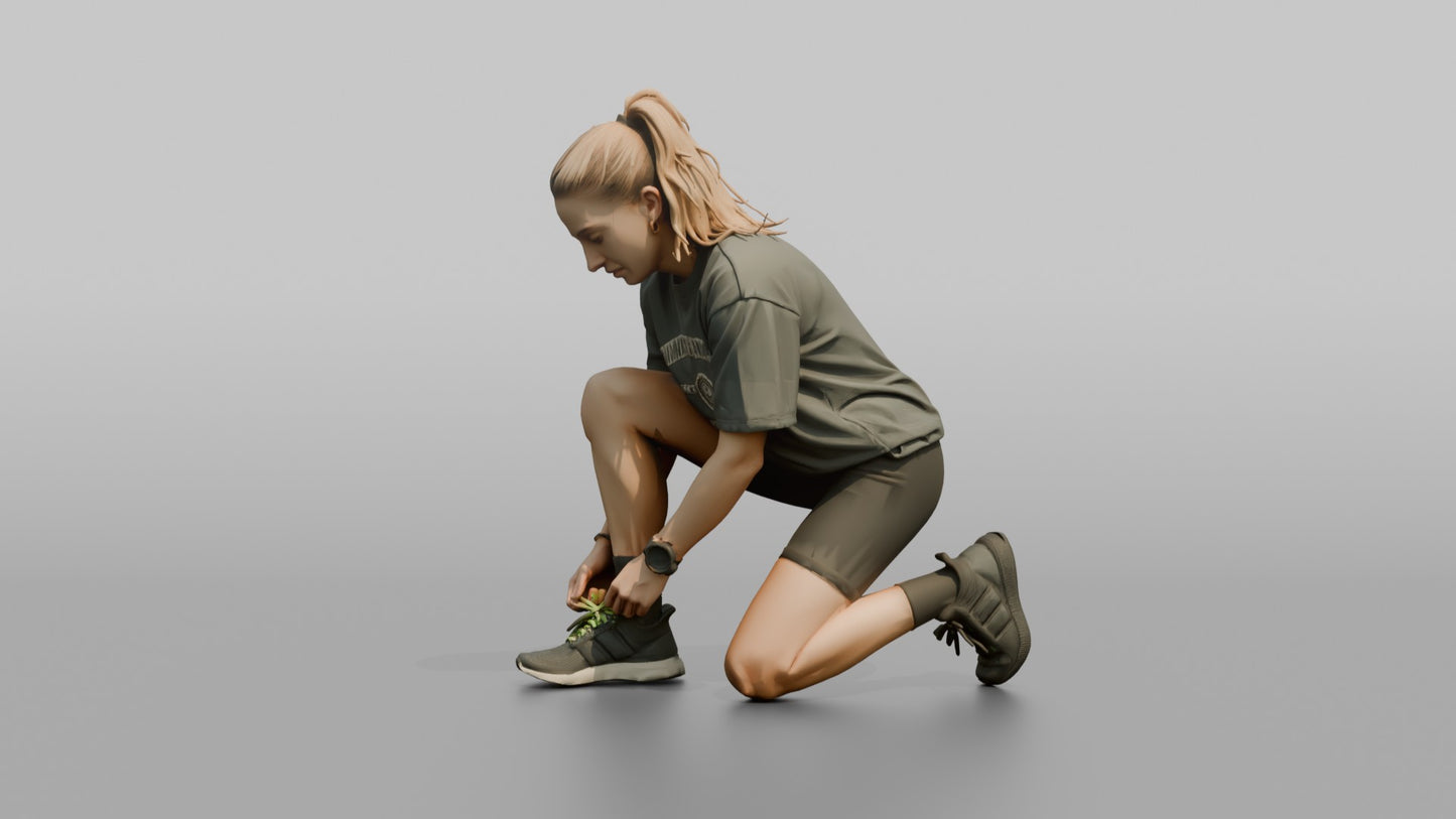 Woman Kneeling to Adjust Her Sneaker Laces