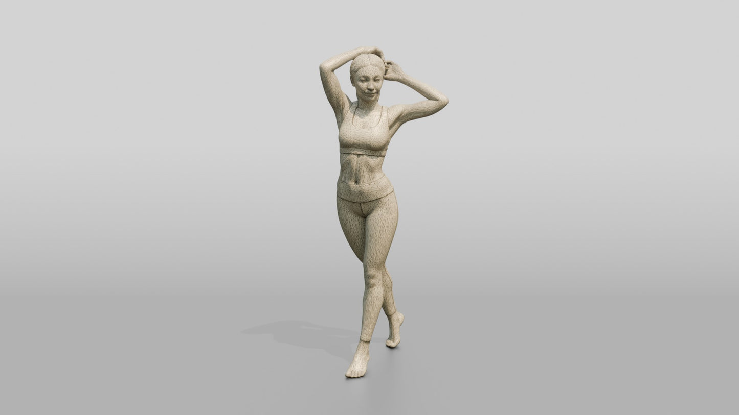 Woman in Lilac Activewear with Arms Raised to Her Hair