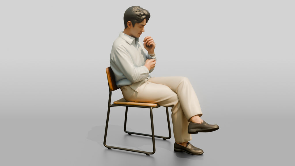 Businessman Sitting in Light Blue Shirt