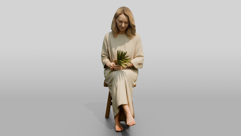 Woman Holding a Palm Leaf on a Chair