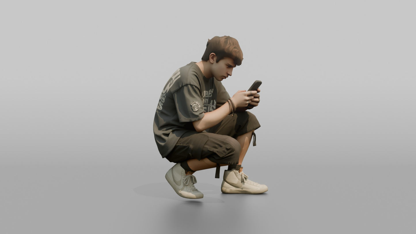 Teenage Boy Crouching to Look at His Phone