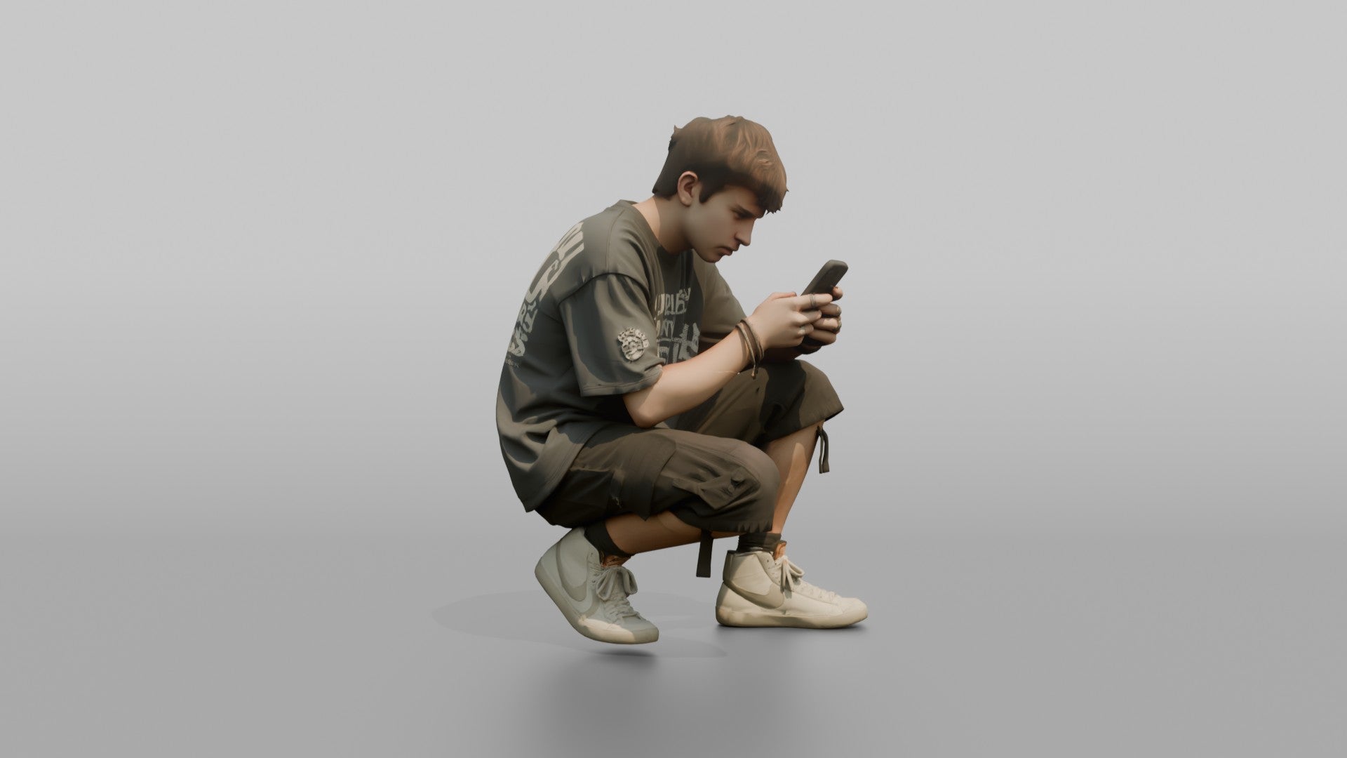 Teenage Boy Crouching to Look at His Phone